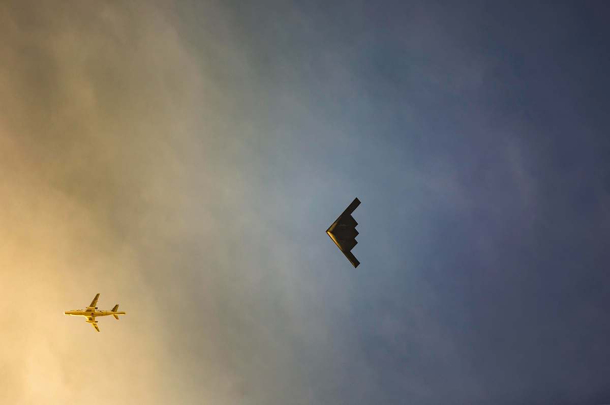 leisure activities black bird flying on sky during daytime animal